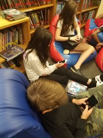 kids on tech devices.jpg